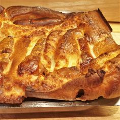 a large piece of bread sitting on top of a pan