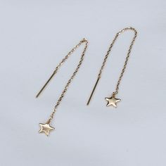 14K Gold Tiny Star Threader Earrings The earrings are 14K gold 14k gold tiny star charm is about 6mm The earrings will be shipped in a nice gift box. To see add-on click on the link below. https://www.etsy.com/shop/SashJewelry?section_id=12359884 To see more children's jewelry click on the link below. http://www.etsy.com/shop/SashJewelry?section_id=12441132 To see more Sash Jewelry items click on the link below. http://www.etsy.com/shop/SashJewelry Please don't hesitate to contact me for custom Multi Chain Bracelet, Double Chain Bracelet, Children's Jewelry, Gold Slides, Solid Gold Bracelet, Tiny Star, Toggle Bracelet, Childrens Jewelry, Threader Earrings