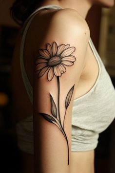 A detailed black and white daisy tattoo on a person's upper arm. Daisy Crown, Meaningful Tattoo, Fresh Tattoo, Detailed Artwork