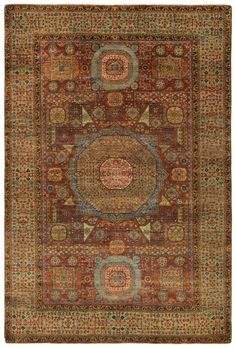 an antique rug with many different colors and patterns