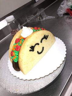 a taco cake is sitting on a plate