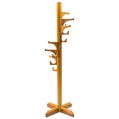 a wooden coat rack with four hooks on it