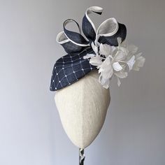 "READY TO SHIP TODAY ☀ Follow this link for more beautiful choices from 'Indigo Hats'  https://www.etsy.com/shop/IndigoHats ☀ ELOQUENCE Fascinator Handmade with care by Jaine You will look very stylish in this one and the feathers give it lovely movement. I hand blocked (steamed and stretched and pinned straw around a wooden shape)  a classic navy sinamay straw into this elegant teardrop percher shape.  I picked up the block on my last trip to England and I just love it.   After blocking I added Chic Adjustable Fascinator With Pinched Crown, Fitted Mini Hat With Structured Crown In Sinamay, Chic Fitted Top Hat With Structured Crown, Fitted Sinamay Headpiece For Kentucky Derby, Fitted Sinamay Headpiece With Structured Crown, Chic Fitted Fascinator With Structured Crown, Chic Structured Crown Fascinator, Chic Fitted Costume Hat With Structured Crown, Kentucky Derby Fitted Fascinator With Structured Crown