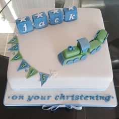 a birthday cake for a baby boy with blocks spelling it out