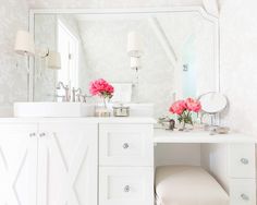 a white vanity with pink flowers on it