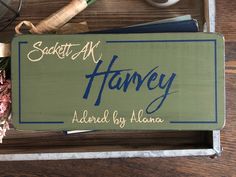 there is a sign that says sogett at harvey above it are other things on the table