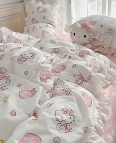 a hello kitty bed set with pink and white sheets, pillows and pillowcases