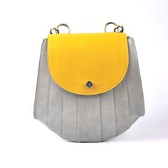 "This  Designer Genuine Leather Handbag Bag, Handmade Leather Bag, Handbag, Woman Leather Bag, Elegant Leather Bag, Shoulder Purse For Women. This leather is genuine and durable with little care it will last for years. You can keep the leather in good form by using leather balm. Item Description: *Material: Genuine leather *Dimensions: 3.5X10x9.50\" inches Bag *Compartment: 2 *Closure Type: Zipper *Handle: 13\" Inches  *Color options: Yellow & Gray (other colors available on request) *Care Instr Yellow Shoulder Flap Bag For Everyday Use, Yellow Satchel Flap Bag For Everyday Use, Yellow Leather Mobile Phone Bag, Everyday Yellow Satchel Flap Bag, Yellow Flap Bag With Adjustable Strap For Everyday Use, Yellow Leather Satchel With Mobile Phone Bag, Yellow Leather Flap Bag For Everyday Use, Handmade Everyday Standard Backpack, Yellow Rectangular Leather Backpack For Everyday Use