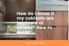 a kitchen with cabinets and a bowl of fruit on the counter in front of it