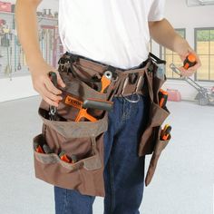 a man is holding tools in his pockets