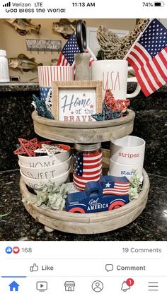 patriotic coffee cups and mugs are stacked on a tray