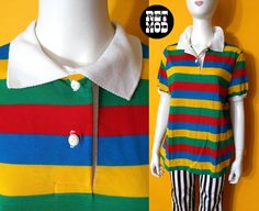 "Bright Vintage 70s Colorful Stripe Polo Shirt by Young Stuff I believe this is NWOT (new without tags)! Feels really crisp and fresh. Please note that colors can vary from screen to screen, and in real life. Photos make the colors seem muddy, but its actually bright in real life. Has stretch. Shoulder 16\" (laid flat) Bust 22.5-25\" (laid flat) Length, Top to Bottom 26\" Bottom Opening 23\" (laid flat) Sleeve Length 8\" Sleeve Opening 5-9\" (laid flat)  Tag: Young Stuff / Size 40 Condition: 2 ( Retro Multicolor Tops With Rainbow Print, Retro Multicolor Rainbow Print Top, Colorful Retro Color Block Tops, Retro Multicolor Collared T-shirt, Retro Green Collared T-shirt, Multicolor Collared Top With Retro Print, Retro Collared T-shirt For Spring, Retro Rainbow Cotton Tops, Retro Multicolor T-shirt