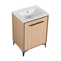 a white sink sitting on top of a wooden cabinet