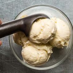 two scoops of ice cream in a glass bowl