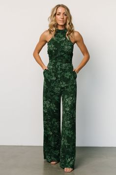 Elevate your style with our deep green jumpsuit adorned with a beautiful green multi-flower design. With convenient side pockets, this jumpsuit combines fashion and functionality, making it a perfect choice for any occasion. Officiant Attire, Wedding Guest Pants, Formal Wedding Attire, Green Floral Design, Jumpsuit Dressy