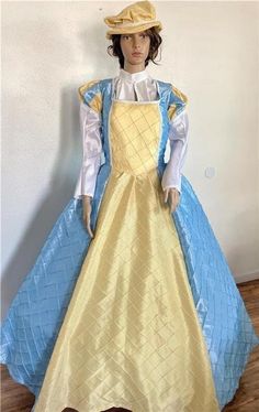 This listing is for a one piece Elizabethan, Renaissance, Medieval, Romeo & Juliet dress/gown and hat, your custom size choice of busts 30" to 44". The dress is made of a mix of light blue and yellow pintuck taffeta with the lower straight sleeves being made of white taffeta.  There is white gimp trim throughout.  And the flat hat is made of matching yellow pintuck taffeta with the same trim and a small brim.  The  bodice and upper sleeves are fully lined, and the dress laces down the back with Blue Ball Gown For Fancy Dress, Vintage Blue Costume Dress, Royal Long Sleeve Costume Dresses, Royal Blue Royal Dresses For Costume Party, Royal Blue Costume Dress, Blue Fitted Gown For Fancy Dress, Fitted Blue Victorian Dress For Fancy Dress Events, Blue Princess Gown For Costume Party, Royal Gown For Costume Event