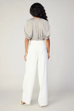 Timeless white tailored trouser pants with a high waist and pleating at the front. High waist Pleated front Zip fly with button closure Faux welt pockets at back White Tailored Pants, Pleated Wide Leg Pants, Print Trends, Tailored Pants, Sweater Sale, Sweater Blouse, Trending Dresses, Outerwear Coats, Trouser Pants