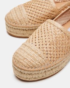 The BAYWALK shoe boasts an espadrille platform sole and rounded toe, providing both style and comfort. These features make it a perfect choice for any occasion, allowing you to elevate your look while standing on a stable base. Walk with confidence and flair in these chic shoes. 1.75 inch heel height Raffia upper material Synthetic lining Leather sock Synthetic sole Imported Beach Wedding Shoes, Espadrilles Platform, Chic Shoes, Platform Espadrilles, Leather Socks, Women's Flats, Spring Tops, Elevate Your Look, Flat Espadrilles