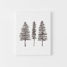 three pine trees are shown in black and white on a paper towel or wall hanging