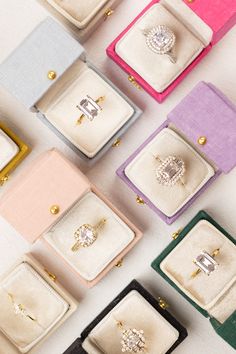 many different colored clutches with diamond rings on them, all lined up in the same row