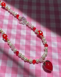 A slice of strawberry shortcake anyone? 🍰✨ This beautifully beaded necklace is made with glass pearls, crystals, strawberry lamp work beads, rose quartz beads & seed beads. Tag someone in the comments who would love this piece! ❤️ #strawberrynecklace #beadedjewelry #pearlnecklace Strawberry Lamp, Strawberry Necklace, Rose Quartz Beads, Quartz Beads, Strawberry Shortcake, Tag Someone, Instagram A, Rose Quartz, Seed Beads