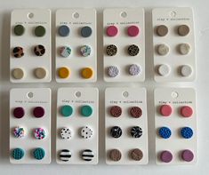 six pairs of earrings with different designs on them