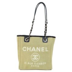 General: Brand: Chanel Design: Type: Tote bag Material: Canvas Color: Beige, Black Gender: Women Size: Size (HxWxD): 26.5cm x 31cm x 10cm / 10.43'' x 12.2'' x 3.93'' Included Items: Accessories: card Accessories Notice: Before purchasing, please refer to the images of the accessories included with the item. Condition: Condition: Used (very good) Ranking: Rank A Used - A few traces of usage, some scratches / dirt can be seen but overall in very good condition Seller Ranking: Rank A Overall Scratc Chanel Tote Bag, Card Accessories, Chanel Design, Chanel Tote, Louis Vuitton Designer, Handbag Wallet, Chanel Deauville Tote Bag, Bag Canvas, Wallet Accessories