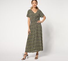 An elegant summer dinner party, a graduation celebration, or a conference sesh are just a small sampling of the places where this versatile crinkle knit midi dress wins for its combo of chicness and move-freely comfort. The others? Well, that's totally up to you! From Isaac Mizrahi Live!TM.  Fabrication: crinkle knit Features: short sleeves, front twisted knot design, waist and center-front seams, straight bottom hem Fit: semi-fitted; follows the lines of the body with added wearing ease Length: Casual Viscose Maxi Dress For Evening, Casual Evening Maxi Dress In Viscose, Casual Viscose Maxi Dress For Party, Ruched Viscose Maxi Dress For Summer, Casual Rayon Midi Dress For Party, Summer Dinner Party, Dinner Party Summer, Knot Design, Graduation Celebration