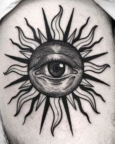 a man's thigh with an all seeing eye tattoo on it