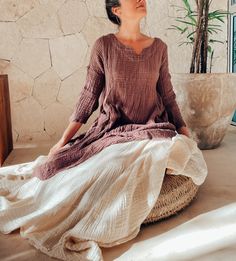 "Introducing our coziest top yet, like wearing a hug. Pockets in the front make this top casual and easy to wear. It easily becomes the top of choice when changing into cozy time: that's all the time at Cotton Flower! Pairs beautifully with flowy skirts, our Dakini pants, Yoga pants, and leggings. Be oh-so-snuggly in this top! We are only offering one size at this time. This top fits XS to Medium. Measurements: Bust up to 36\" Hip up to 66\" Overall length 35\" COLOR VARIATIONS Our clothes are h Boho Fall Outfits, Gauze Clothing, Flowy Skirts, Simple Fall Outfits, Pocket Tunic, Natural Clothing, Cotton Flower, Tiered Skirts, Cozy Tops