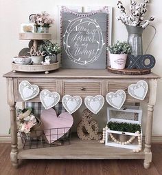 an old dresser has been decorated with hearts and flowers for valentine's day on instagram