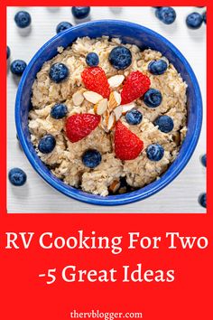 a blue bowl filled with oatmeal and strawberries on top of it