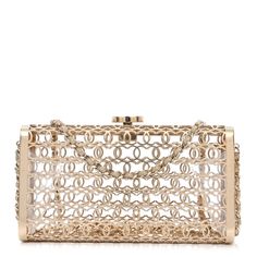 This is an authentic CHANEL Metal CC Moucharabieh Minaudiere Crossbody in Gold. This stunning piece is crafted of gold metal with a leather threaded gold chain shoulder strap and Chanel CC closure hardware. Chic Gold-tone Evening Jewelry, Elegant Evening Jewelry With Gold Clasp, Yellow Gold Jewelry With Chain Strap For Evening, Yellow Gold Jewelry With Gold-tone Hardware For Evening, Gold Jewelry With Gold-tone Hardware For Party, Designer Formal Jewelry With Chain Strap, Luxury Jewelry For Events, Chanel Clutch, Chanel Crossbody