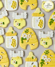 decorated cookies are arranged in the shape of baby bibs