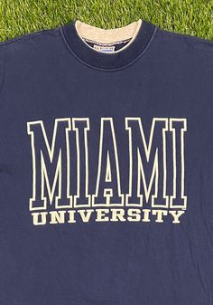 Miami University T Shirt Good Vintage Condition Made by Gear For Sports in the USA Each Vintage item is unique and fits differently. Please refer to measurements for the best fit. Size Medium Width 19 1/4 inch Length 27 inch *Follow LegacyVintage on Instagram* * I ship all items in two or three business days and utilize Priority Mail options via USPS. Expedited shipping is available upon request. If you have any questions; Please Ask! * All of my items are pre-owned and, unfortunately, sometimes Navy Collegiate T-shirt With Letter Print, College Crew Neck T-shirt With Letter Print, Sporty Crew Neck T-shirt With Letter Print, Sporty Navy Pre-shrunk Tops, Navy Letter Print Athleisure Top, Navy Athleisure Top With Letter Print, Athleisure Crew Neck T-shirt For College, College Crew T-shirt With Logo Print, College Athleisure Crew Neck T-shirt