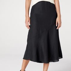 This Black Midi Skirt Is Well Suited For The Season, With The Fine Texture And Barely There Feel Of Handkerchief-Weight Organic Linen Woven From Flax Grown In France. All Kinds Of Flattering, With A Diagonal Bias Seam That Encourages It To Flare Softly And Sweetly At The Hem. By Eileen Fisher Relaxed Fit A-Line Silhouette Elastic Waist With Side Zip And Internal Security Button Midi Length 100% Organic Linen Waist - 38"+, Length - 33 Chic Black Tiered Wrap Skirt, Black Tiered Wrap Skirt In Relaxed Fit, Chic Black Flowy Wrap Skirt, Chic Black Wrap Skirt, Black Casual Wrap Skirt, Relaxed Fit, Black Tiered Wrap Skirt With Lining, Black Tiered Lined Wrap Skirt, Elegant Black Flowy Wrap Skirt, Flowy Black Wrap Skirt With Lining