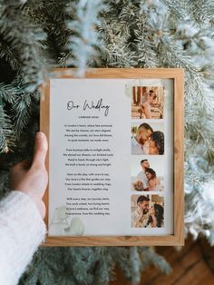 a person holding up a framed photo in front of a christmas tree with the words our wedding written on it