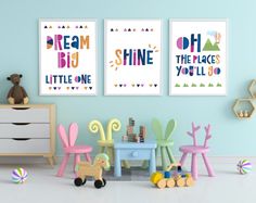 three children's posters on the wall in a child's room with toys