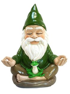 a statue of an old man with a green hat and beard sitting in a lotus position