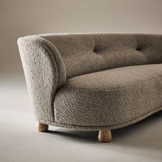 Generously cushioned to hug you as you sit, the Leonne long settee by goop features soft curves of custom wool-blend boucle for a grand statement on a small scale. The sweeping curved back, tufted buttons and teardrop-shaped American white oak legs certified sustainable by the Forest Stewardship Council r FSC come together for a piece that is elevated and timeless. Designed for small spaces, the sophisticated settee is also perfect for creating intimate seating in larger rooms. CB2 exclusive.  - Natural Linen Sofa, Precedent Study, Boucle Cushion, Ceramic Dinnerware Set, Leather Sectional Sofa, Linen Sofa, Old Fashioned Glass, River House, Curved Back