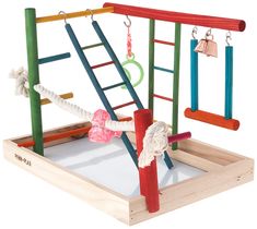 a wooden toy set with various colored bars and bells hanging from it's sides