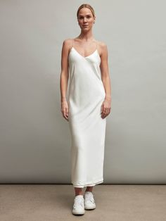 Upgrade your Satin Slip Dress with our new elevated version of this classic style. Featuring our ivory color with a criss cross back and pearl adjustable straps. Wear this dress with sneakers for brunch or heels for a night out! Satin Dress With Sneakers, Dress With Pearl Straps, Pleated Tennis Dress, Pearl Straps, White Satin Dress, Satin Set, Satin Jumpsuit, Satin Short, Carbon 38