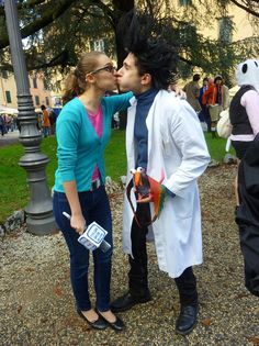 two people dressed as characters kissing each other