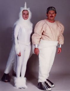 two people dressed in costumes standing next to each other