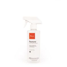 a bottle of restore on a white background with a red and white sprayer