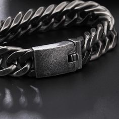 A punk rock style accessory that looks fierce in any venue from a concert to a backyard bash; embrace the rock and roller within each time you rock this vintage bracelet on your arm. ✔ Condition: 100% Brand New and High Quality✔ Made of 316L Stainless Steel and Genuine Leather✔ Available in 12 and 15mm width✔ Length is 21.5cm✔ Weighing in at an impressive around 101 grams✔ Packaging comes in gift bag Black Punk Chain Bracelet As A Gift, Black Punk Style Chain Bracelet For Gift, Black Punk Style Chain Bracelet As Gift, Punk Style Black Chain Bracelet Gift, Adjustable Stainless Steel Punk Bracelets, Vintage Silver Jewelry For Concerts, Trendy Metal Wristband For Concerts, Trendy Silver Metal Wristband, Silver Rock Style Jewelry For Party