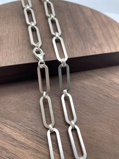 925 Silver Chain Paper Clip Chain 7.2x20mm chain  PRODUCT DESCRIPTION Materials:Silver 925 -Color:White silver,if you need Oxidized(Dark silver) color,please leave message. -Width:7.2x20mm each link -Length:Any length (Can be personalized length) -Clasp can change to other designs. Jump ring:5-6mm.It depends on the chain width.Pleace check your pendant bail to see if can get through it.If you need smaller jump rings,please contact us. All the jump rings will be soldered before we send it to you. Pendant Bails, Star Necklace, White Silver, Jump Rings, Paper Clip, Beaded Chain, Chain Styles, Sterling Silver Chains, Silver Color