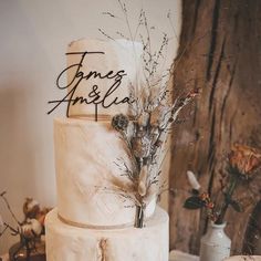 a three tiered cake sitting on top of a table