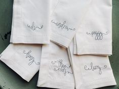 six embroidered napkins with the words happy mother written in cursive writing on them