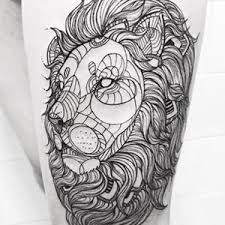 a man's leg with a lion tattoo on the side of his body,